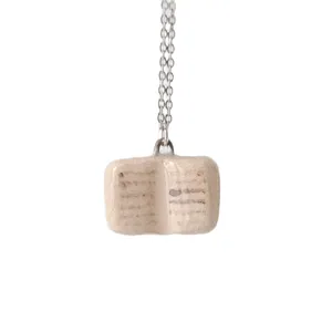 Minimalist stainless steel necklace with creamy white open book pendant and enamel finish