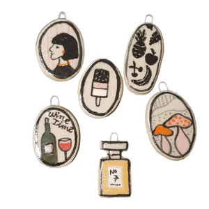 Vintage hand-drawn stainless steel drip oil pendants set with artistic designs