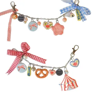 Porte-clés artisanal en acier inoxydable style dopamine avec pendentifs pain et nœuds
