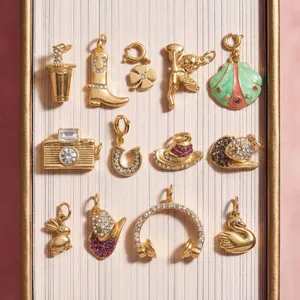 Assorted 18k gold plated stainless steel DIY charms featuring boot, camera, and swan shapes