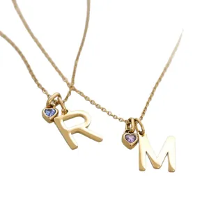 Personalized gold stainless steel initial necklace with heart-shaped birthstone charms