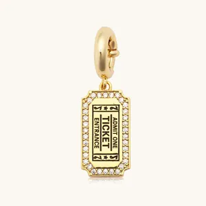 Detail view of 18k gold plated stainless steel ticket pendant with shiny zircon inlay