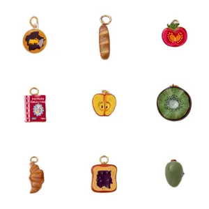 Diverse food and fruit theme DIY jewelry charms with gold rings on white background