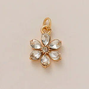 Detailed view of 18K gold plated flower charm with sparkling crystal petals
