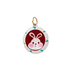 Handmade cute white rabbit shoe charm pendant with red background and gold metal ring