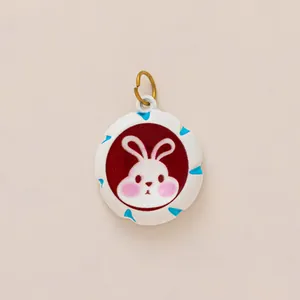 Detailed view of a cute white rabbit pendant charm for DIY shoe decoration and jewelry