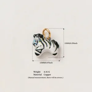 Detailed macro view of enamel zebra charm showing 15mm height and copper material specs.
