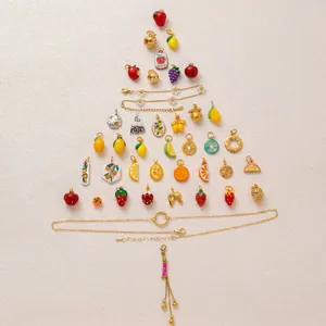 Creative arrangement of colorful stainless steel fruit charms and gold necklaces