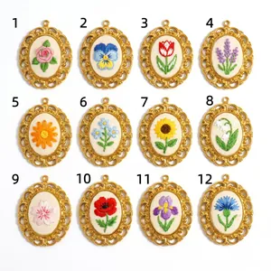 Detailed showcase of 12 vintage-style embroidered floral pendants with golden frames