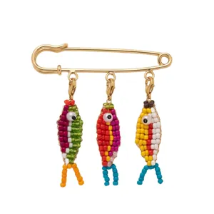 Fashionable 14k gold plated safety pin brooch with colorful beaded fish charms pendant