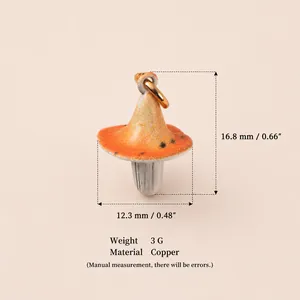 Detalle de dije de hongo de cobre con dimensiones de 16,8mm y peso de 3g informado
