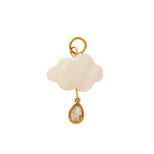 Minimalist vintage white cloud bag charm featuring a teardrop crystal pendant in gold
