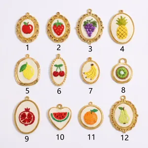 Detailed view of 12 various fruit embroidery charms numbered for easy selection