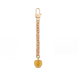 Fashionable rose gold chain bag charm with a cute yellow apple slice pendant accessory