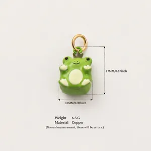 Detail view of a green enamel frog pendant showing dimensions of 17mm by 10mm