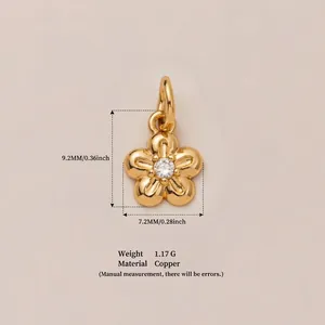 Detailed size and weight view of a five-petal flower charm in 18K gold-plated copper