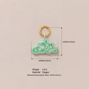 Detail view of green cloud pendant with 11x16mm dimensions and copper material specs