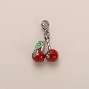 Detailed view of stainless steel cherry pendant with sparkling rhinestones and lobster clasp