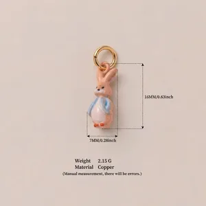 Close-up of hand-painted enamel rabbit pendant showing dimensions and copper material
