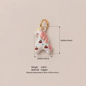 Detailed view of enamel unicorn pendant showing 15mm height and copper material specs