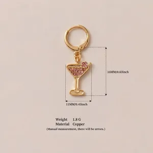 Detailed view of gold martini glass earring with pink crystal accents and measurements.