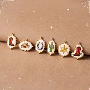 Detail showing cowboy-style embroidered charms including boots, hat, and cactus