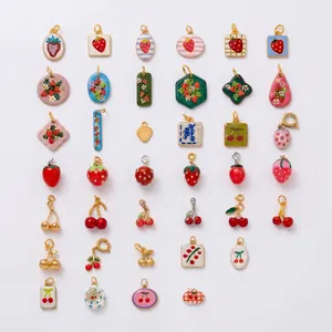 Assorted stainless steel fruit charms including strawberries and cherries for DIY jewelry