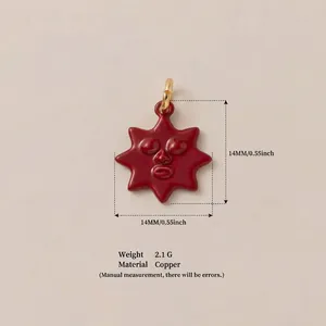 Detail view of a 14mm red sun face pendant made of copper material