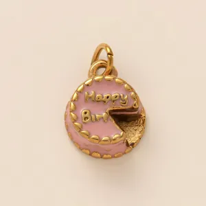 Detailed view of pink enamel cake charm with gold Happy Birthday engraving for DIY jewelry