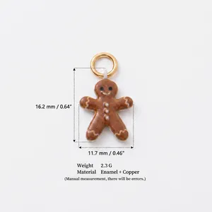 Macro detail of a gingerbread man enamel charm pendant with measurement annotations