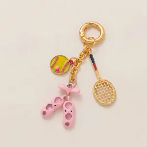 Elegant vintage bag charm featuring tennis racket, ballet slippers and baseball