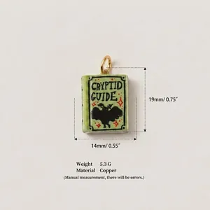 Detailed view of green copper cryptid guide book pendant with dimensions and weight