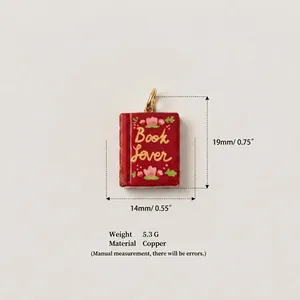 Miniature red book pendant charm in copper with 'Book Lover' engraving and measurements