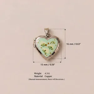 Close-up of heart locket pendant with dimensions and floral print for DIY jewelry making
