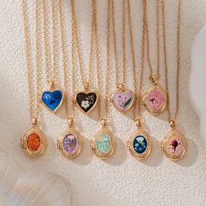 Vintage gold locket necklaces with colorful floral patterns in heart and oval shapes
