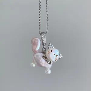 Detailed macro shot of an imitation pearl cat pendant with sparkling CZ ears.