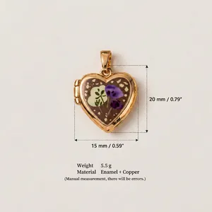 Detailed view of heart locket pendant with floral enamel and size specifications
