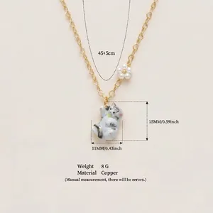 Detail view of a cute cat pendant necklace with size measurements and copper material specs.