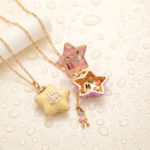 Detailed macro view of open and closed star locket necklace with miniature scene