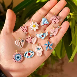 Detailed view of colorful double-sided printed acrylic pendants with whimsical patterns