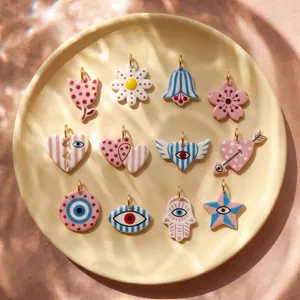 Selection of colorful acrylic printed pendants in various artistic shapes and patterns.