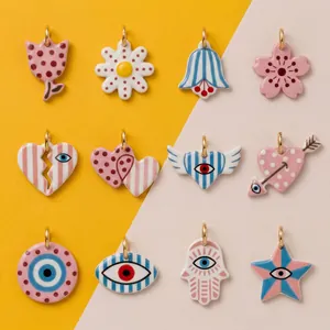 Detailed view of various colorful acrylic pendants with pop art and evil eye patterns