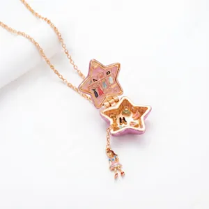Gold-plated star shaped locket necklace with miniature closet scene and girl doll pendant