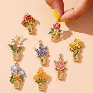 Close-up of colorful enamel flower pot charms with elegant gold-plated finish details