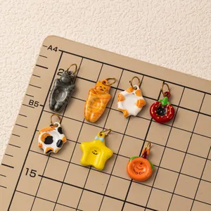 Collection of colorful cartoon cat, star, and fruit pendants for DIY jewelry making.