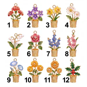 Selection of twelve distinct gold-toned birth month flower charms with enamel details