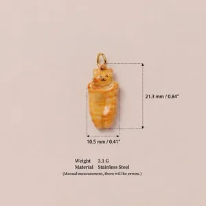 Detailed macro view of chubby orange tabby cat pendant showing precise dimensions and weight
