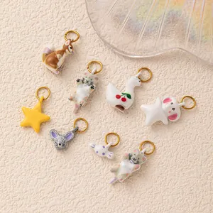 Detailed view of assorted forest animal and star charms for jewelry making