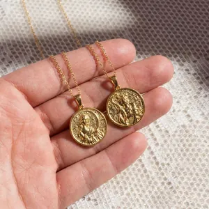 Gold-plated round goddess coin pendant necklace with embossed relief design in hand