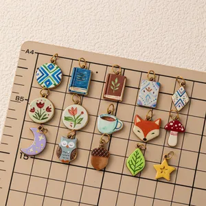 Variety of colorful enamel charms for DIY jewelry making including floral and animal designs